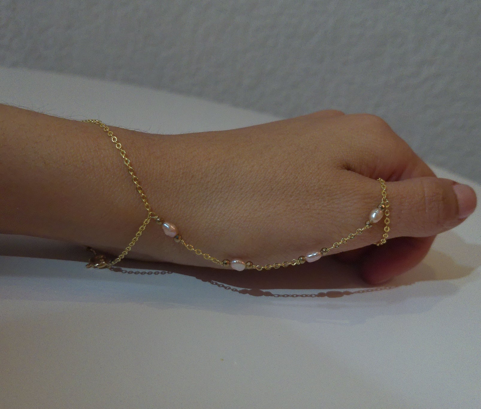 Pink pearl hand chain